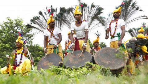 Tribals getting ready for dance during karma puja celebration